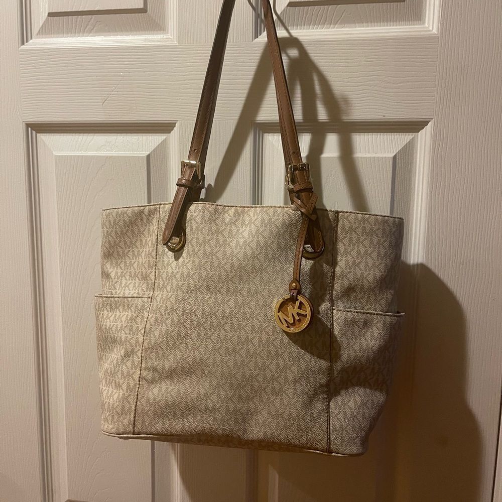 Michael Kors Beige signature Coated Canvas tote , tan leather straps .